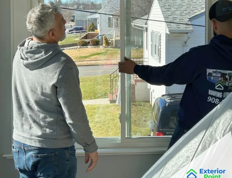 Exterior Point installer walking a homeowner through a new window installation