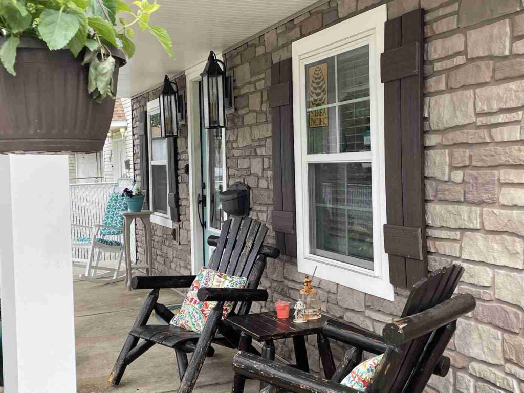 Front porch with stone veneer and white windows