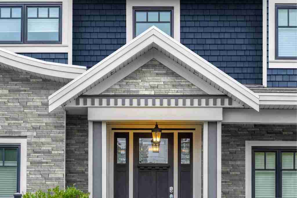 Home with stone veneer and new siding