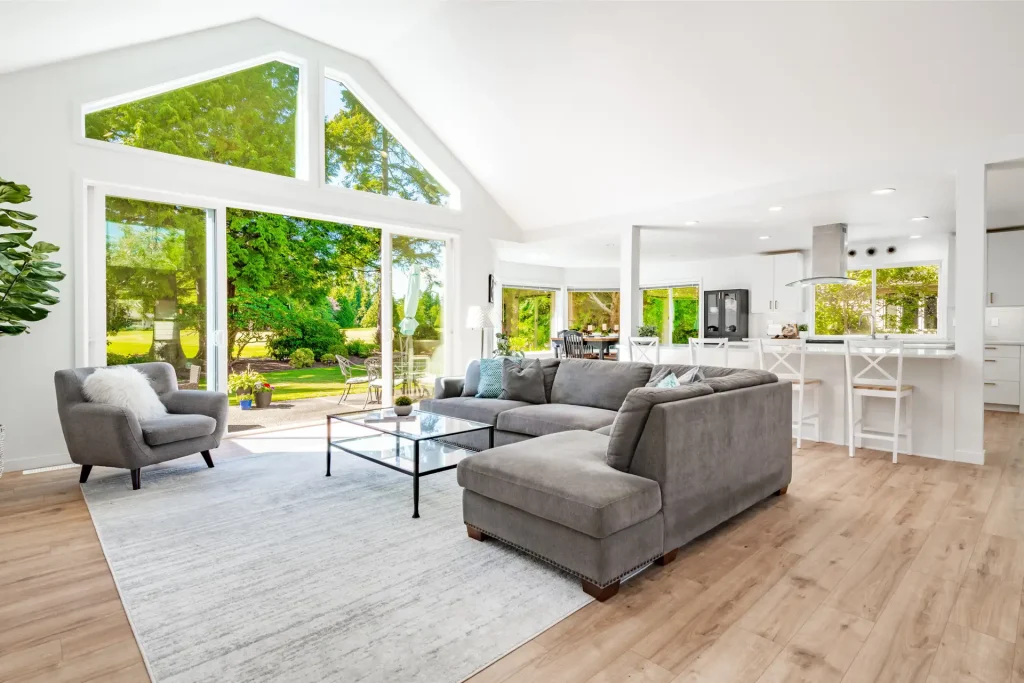 Bright living room with large windows and sliding doors