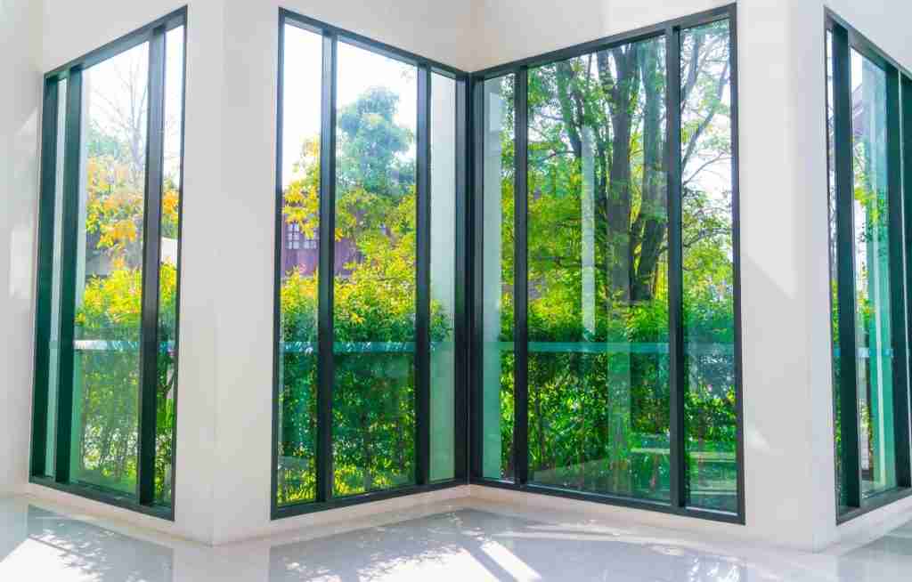 Corner of a room with tall new black-framed windows
