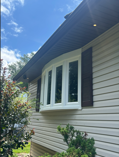 Bow Window with Louvered Shutters