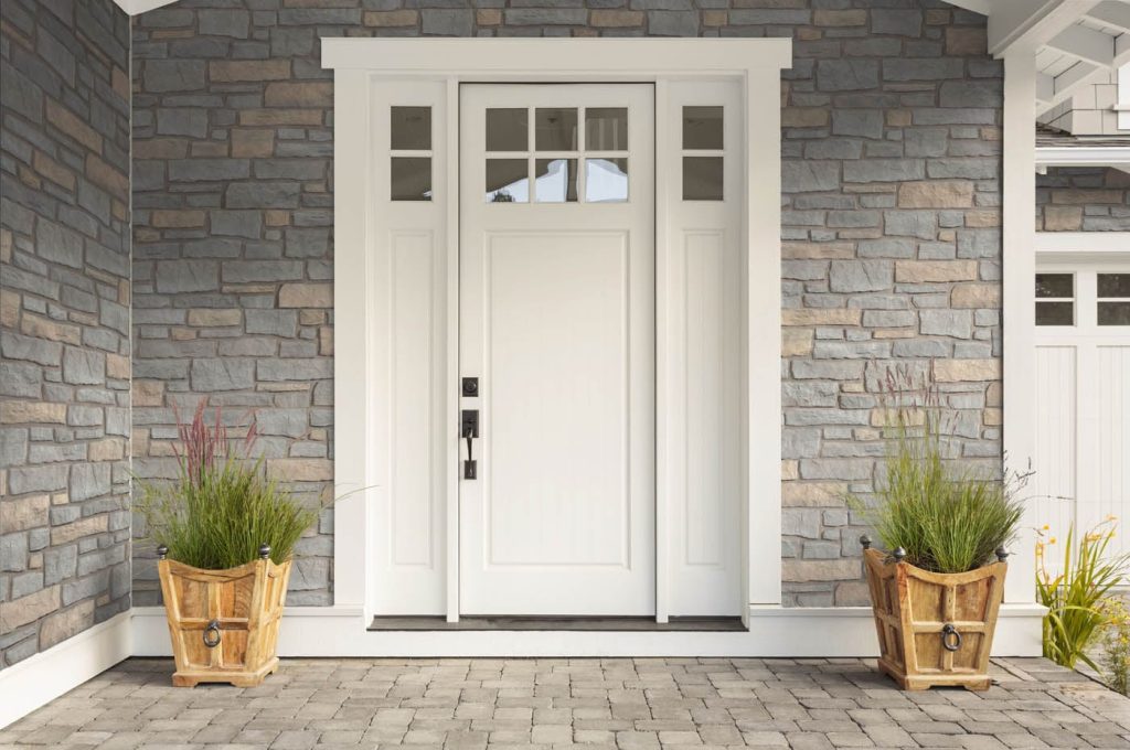 South River NJ 13 White entry door with sidelights surrounded by gray stone veneer