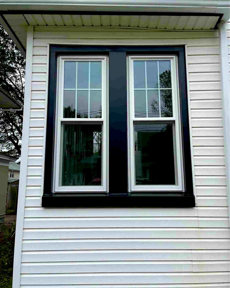 New black aluminum window capping and replacement windows on a home in Morganville, NJ