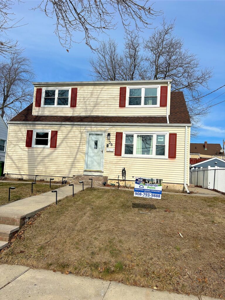 Exterior Point yard sign in front of a Cape Cod with red shutters in Sayreville, NJ