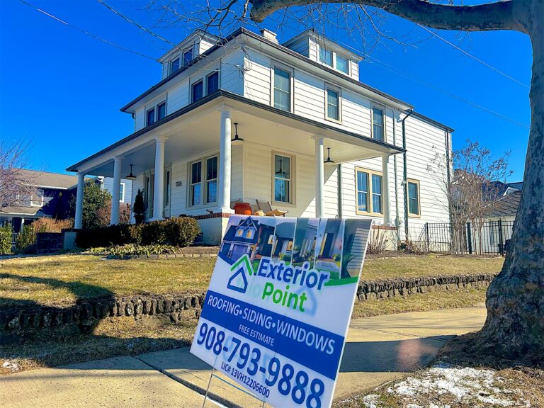 Exterior Point yard sign in front of a white foursquare home with a porch in Atlantic Highlands, NJ