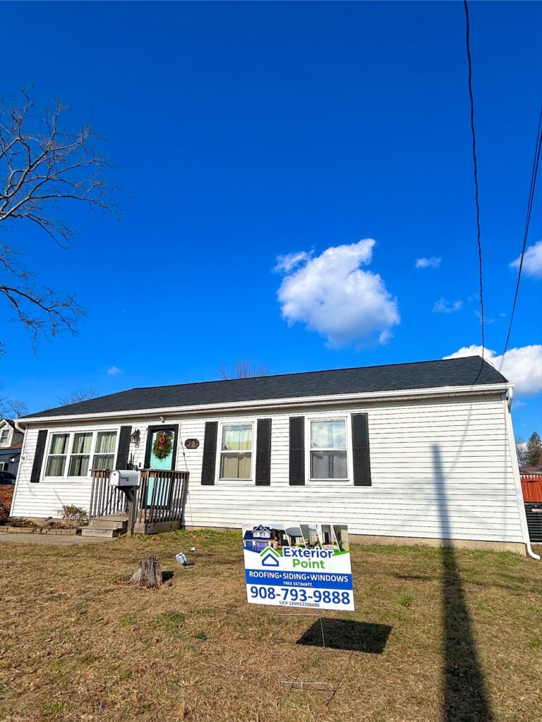 Exterior Point yard sign in front of a white ranch in Keansburg, NJ