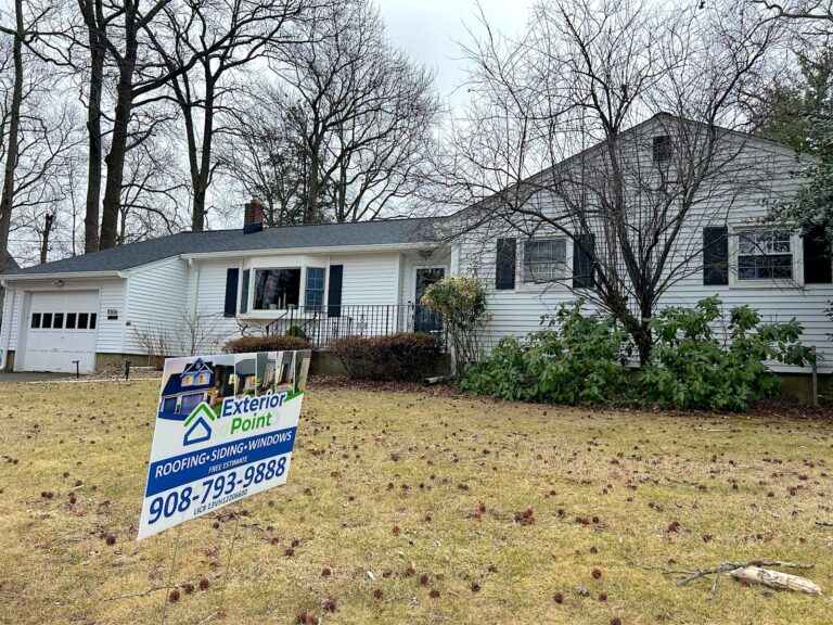 Exterior Point yard sign in front of a white ranch during a roof replacement in Ocean Township, NJ