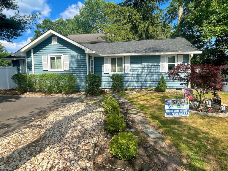 Exterior Point yard sign in front of a blue ranch home in the Parlin area, NJ