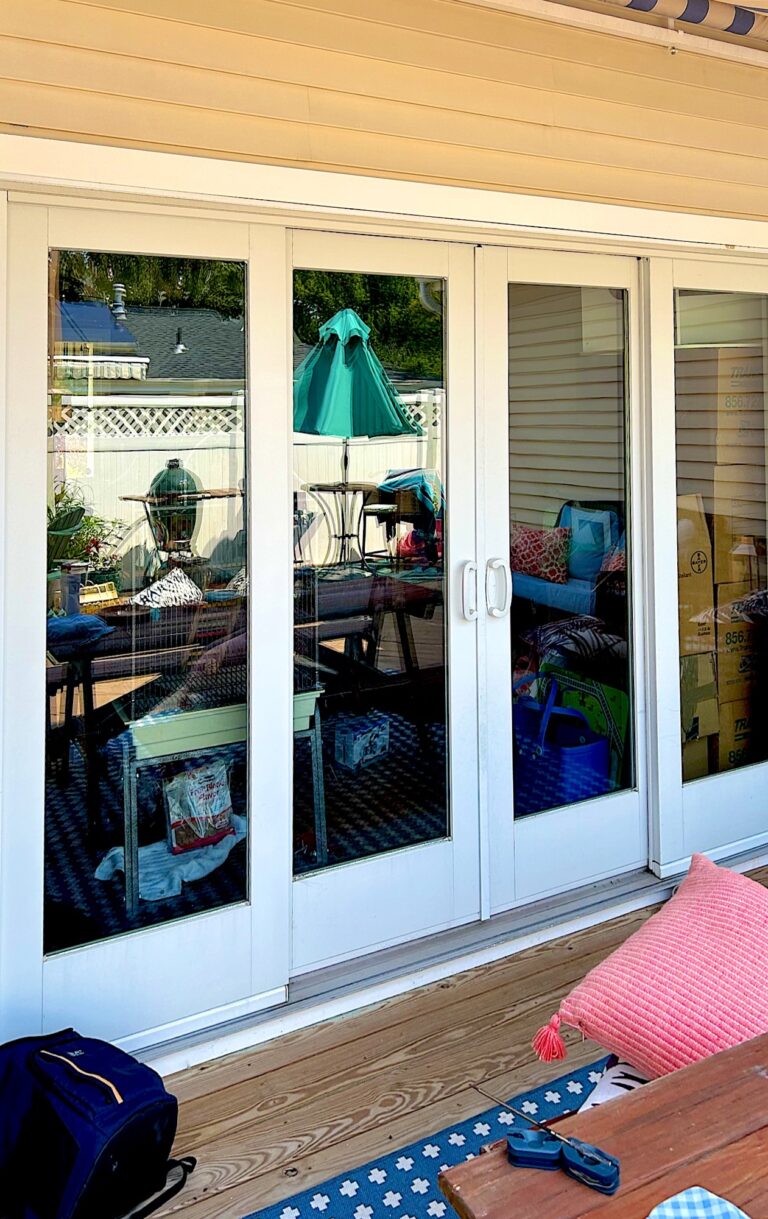 New white French patio doors opening onto a deck in Monmouth Beach, NJ