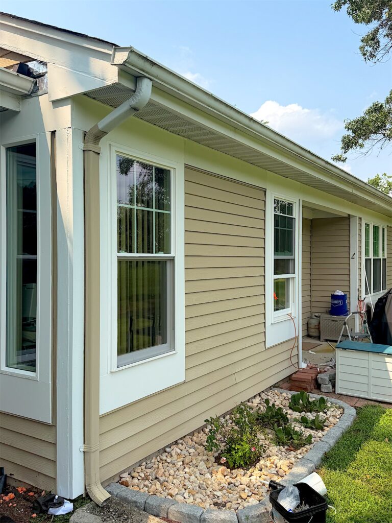 New white windows along the side of a tan-sided ranch in Manchester, NJ