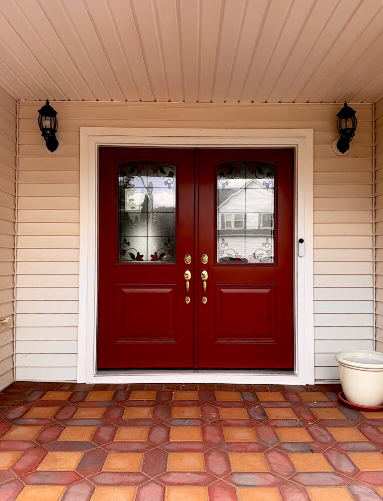 New red double entry doors with decorative glass on a home in Kendall Park, NJ