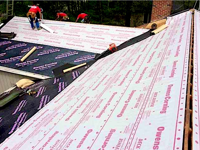 Exterior Point roofers installing new underlayment in Tinton Falls, NJ