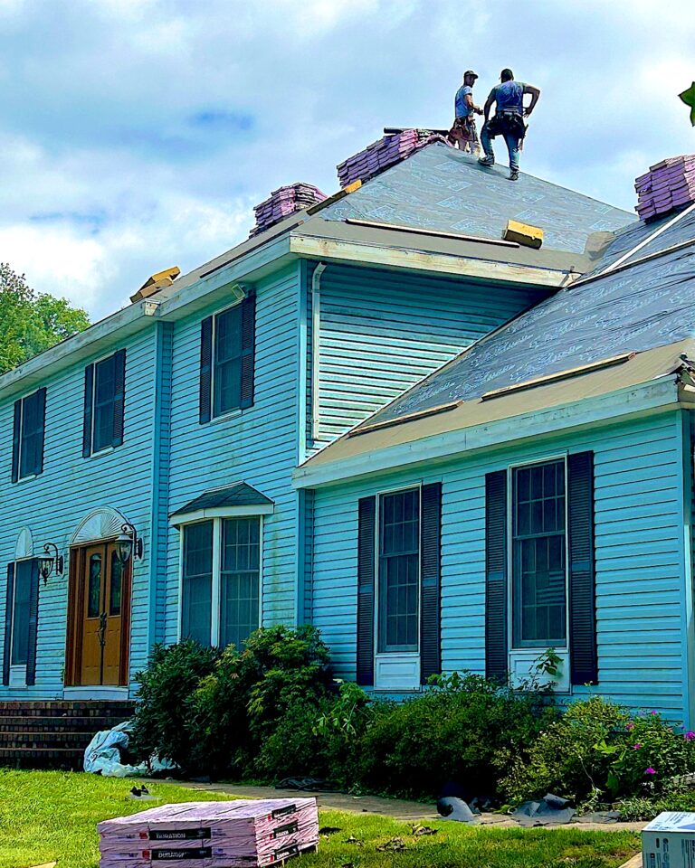 Matawan NJ 7 Exterior Point crew installing a new roof on a blue colonial in Lincroft, NJ