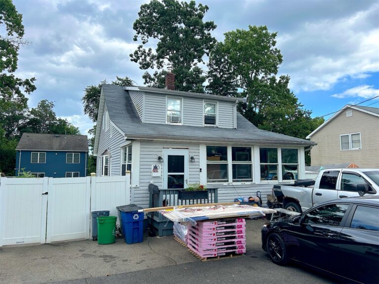 Roofing materials delivered to the driveway for a roof replacement in Keyport, NJ