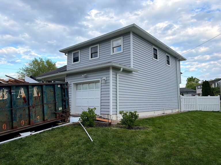 South River NJ 5 Colonial with new gray siding and a dumpster on site in Woodbridge, NJ