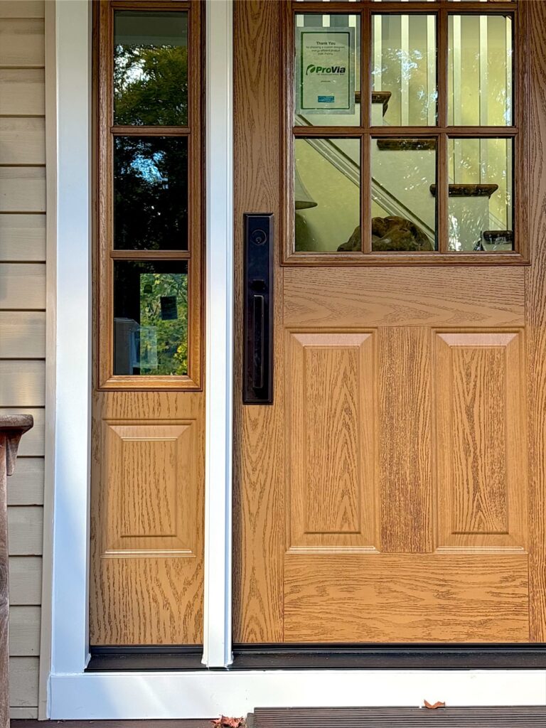 New wood-grain entry door with glass sidelight in Little Silver, NJ